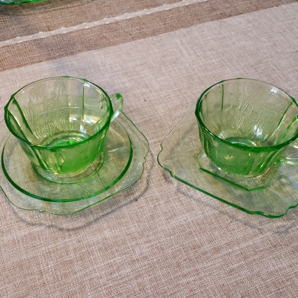 2 Green depression glass cup and saucers